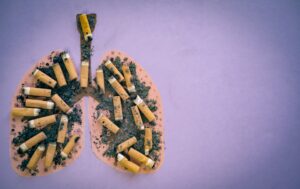 Lungs image with butts cigarettes and Ash from cigarette or cigar smoke. Stop smoking